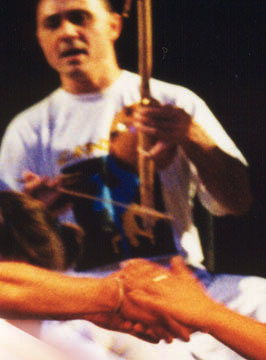 Hand shake at pé do berimbau, roda led by Mestre Beija-flor of Capoeira Paname Hand shake at pé do berimbau, roda led by Mestre Beija-flor of Capoeira Paname