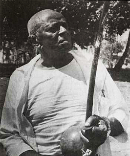 Mestre Bimba holding berimbau Mestre Bimba holding berimbau