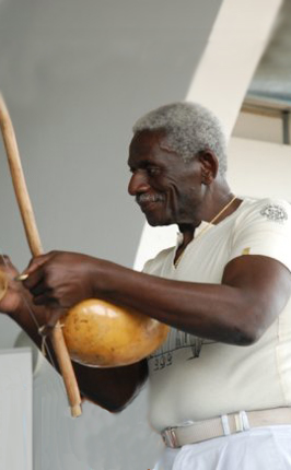 Mestre Sombra playing berimbau, photo by courtesy of Capoeira Canigo Mestre Sombra playing berimbau, photo by courtesy of Capoeira Canigo