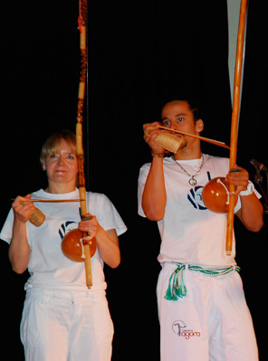 Estagiária Justyna and Professor Thiago playing the berimbaus during the performance in Camden, London, 2009